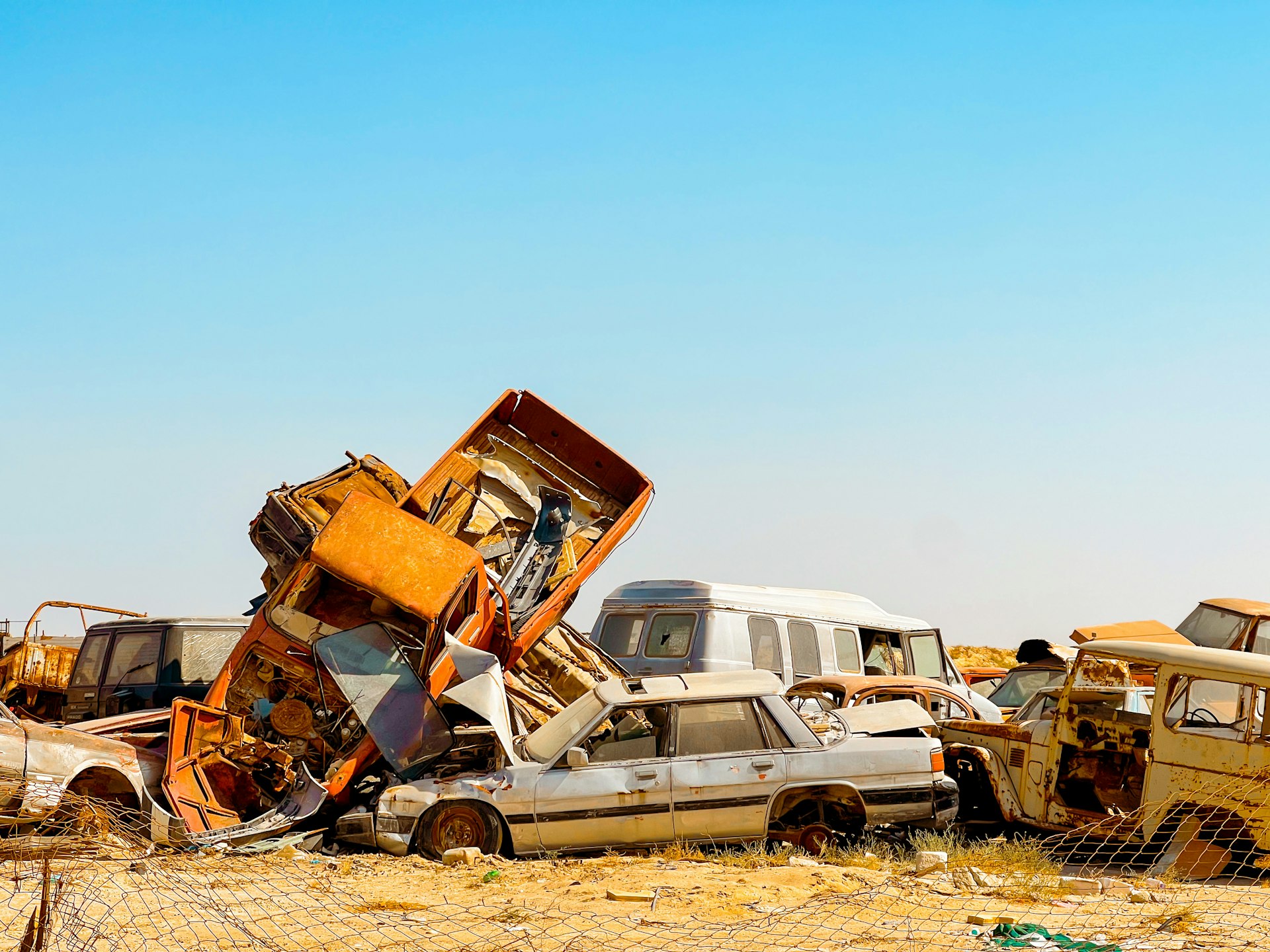 African insurance salvage yard with damaged vehicles awaiting inspection